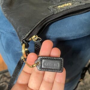 Coach Black Leather Backpack with Gold Accents